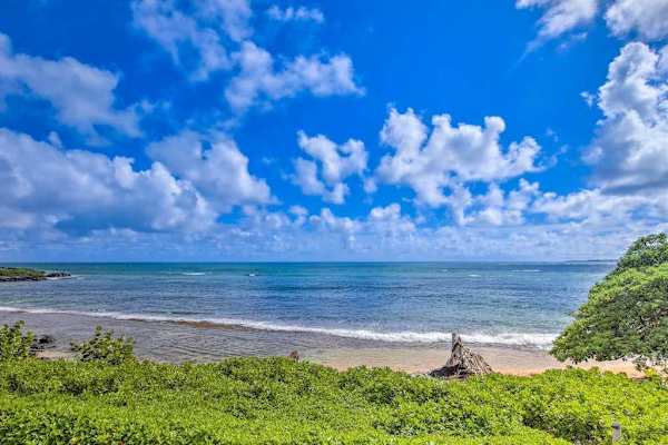 Admire the endless blue horizon from this spectacular beachfront location.