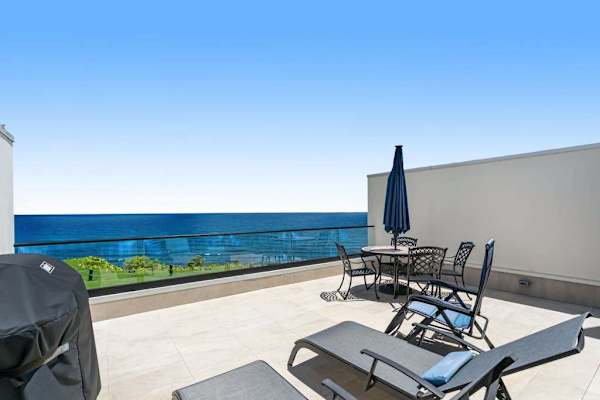 Terrace with loungers, perfect for relaxing to the sound of the waves