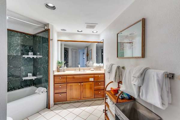 Ensuite bathroom with rain shower, designed to relax after a day at the beach