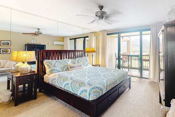 Rest comfortably in this welcoming bedroom with refreshing outdoor views