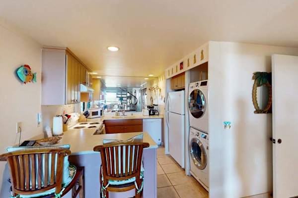 Enjoy casual meals beside the bright and well-equipped kitchen area