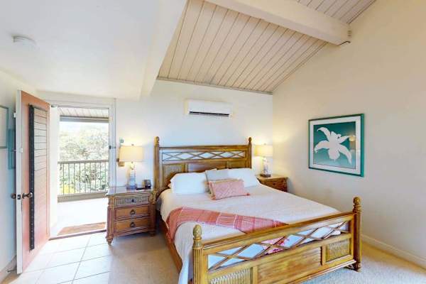 Rest peacefully in this airy bedroom with refreshing outdoor access