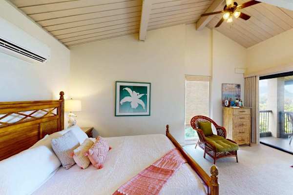 Relax in this bright bedroom after another memorable island day