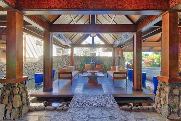 Unwind inside this breezy pavilion surrounded by peaceful tropical scenery
