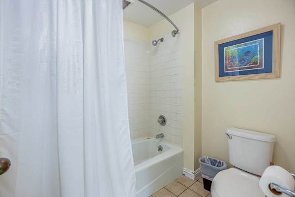 Refresh comfortably in this bright bathroom after sunny island adventures