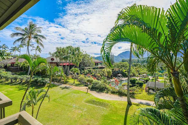 Admire lush tropical gardens and swaying palms from the balcony