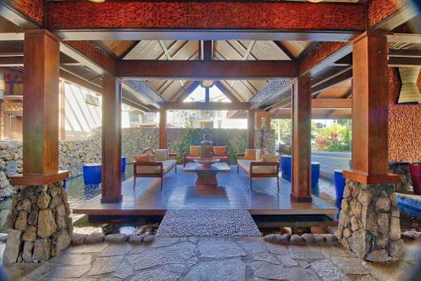 Unwind inside this breezy pavilion surrounded by peaceful tropical scenery