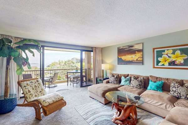 Bright living room offers comfortable seating and relaxing outdoor views