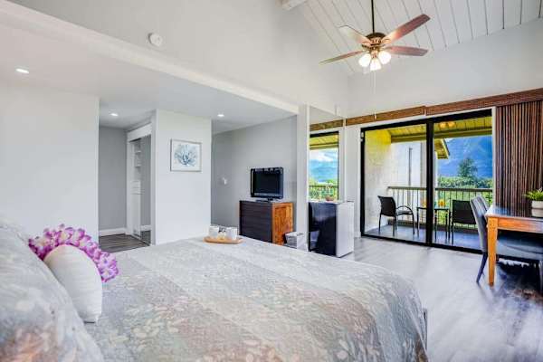Bright bedroom offers plenty of space for relaxing vacation mornings