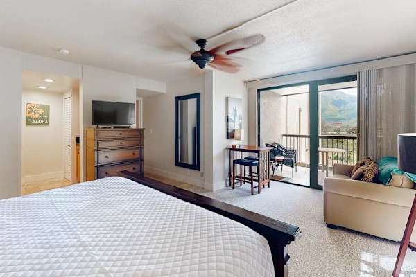 Spacious bedroom offers easy access to comfortable adjoining living spaces