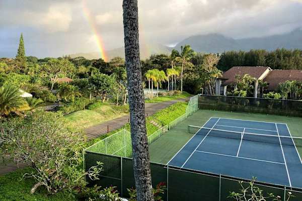 Stay active on tennis courts surrounded by beautiful tropical scenery