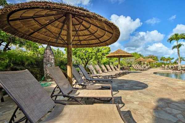 Lounge beneath tropical sunshine and enjoy relaxing moments beside pool