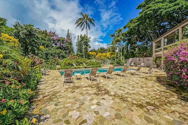 Lounge Poolside Beneath Swaying Palm Trees