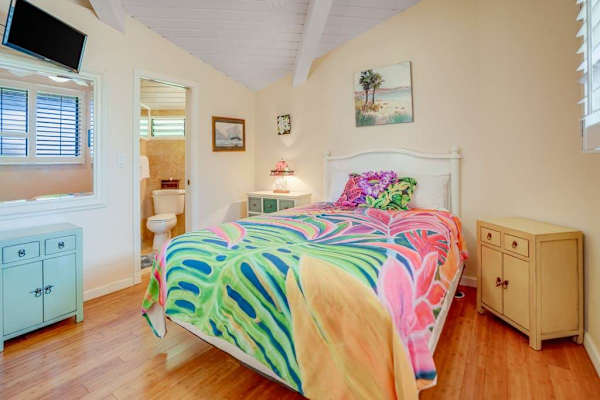 Master bedroom with queen bed, flat screen tv and an ensuite bathroom.