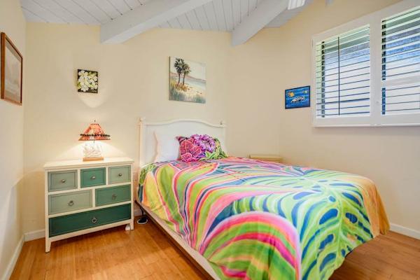 Master bedroom with queen bed, flat screen tv and an ensuite bathroom.