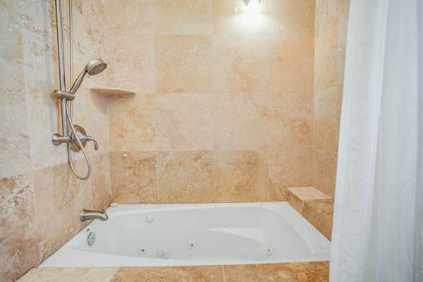 Master ensuite bathroom with garden tub and shower.
