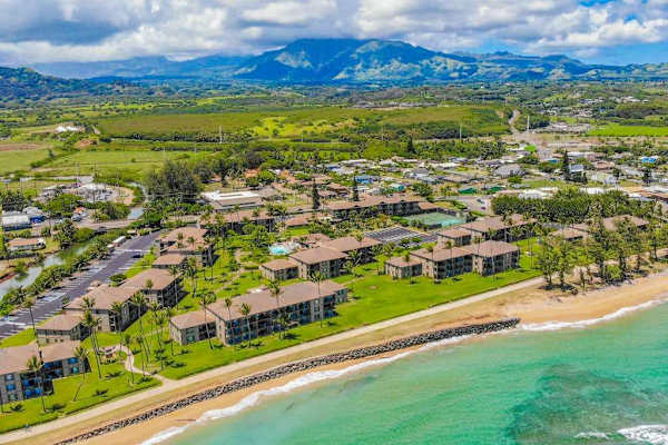 Aerial Coastal View With Mountain Backdrop