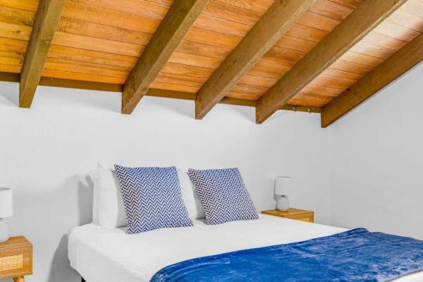 Charming Loft Bedroom With Vaulted Ceilings