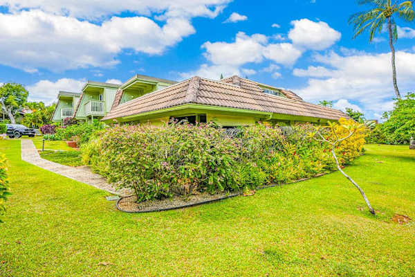 Sprawling Green Lawns & Vibrant Tropical Foliage Surrounding the Unit