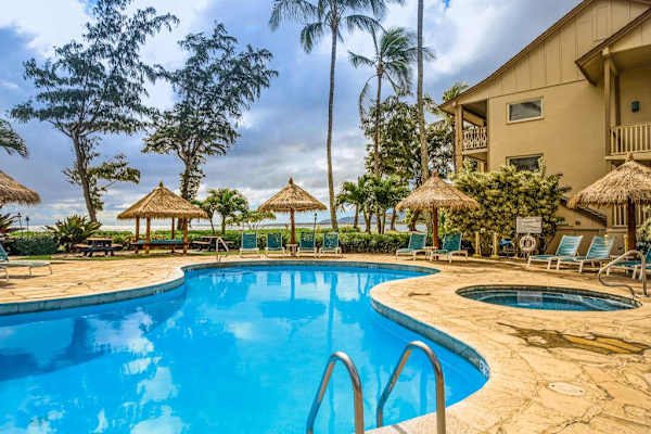 Sparkling Pool Under Swaying Palms
