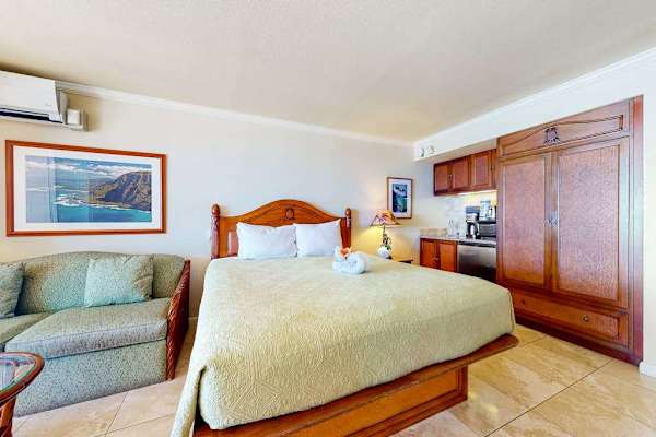 Comfortable studio featuring a spacious closet and cozy seating.
