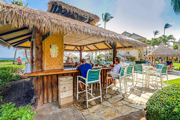 Grab A Refreshing Cocktail At The Poolside Tiki Bar