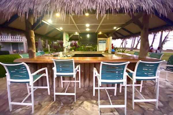 Pull Up A Chair At The Ultimate Poolside Tiki Bar