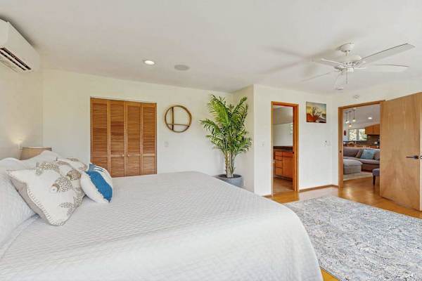 Master bedroom decorated in a modern tropical style