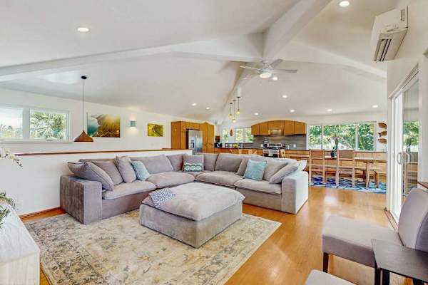 This open-concept great room features a bright, airy coastal style designed for group gatherings