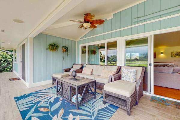 An inviting, coastal-style lanai for outdoor lounging and relaxation
