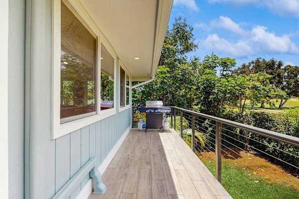An outdoor Balcony with a grill extends alongside the house
