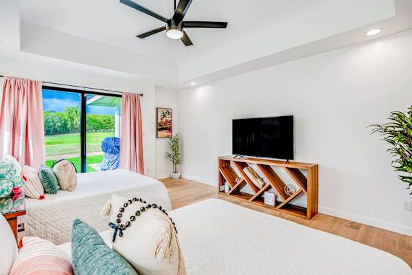 Bright bedroom with TV for relaxing evenings