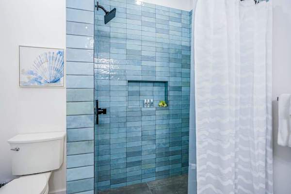 Walk-in shower with stylish tile accents
