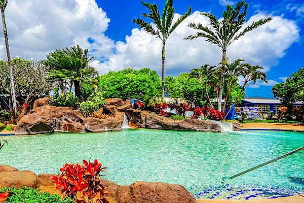 Resort pool surrounded by tropical gardens