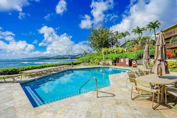  Lounge comfortably beside the beautiful community pool