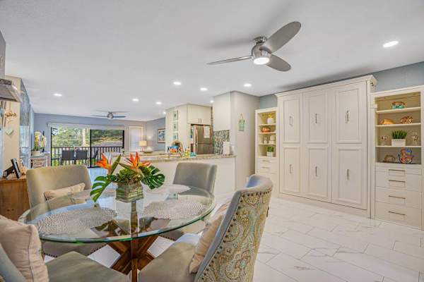Dining Area With Built-In Queen Murphy Bed and a sofa bed.