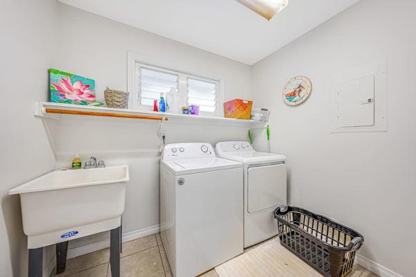 Convenient laundry room with full size washer & dryer