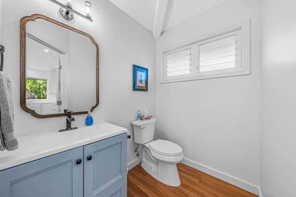 Main floor half bath located near kitchen and living room