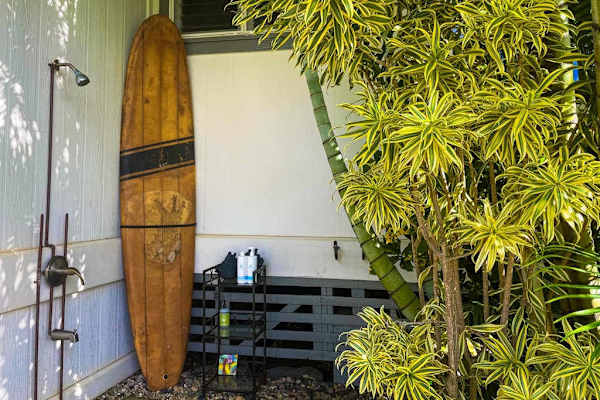 Outdoor shower with surfboard storage & beach gear area