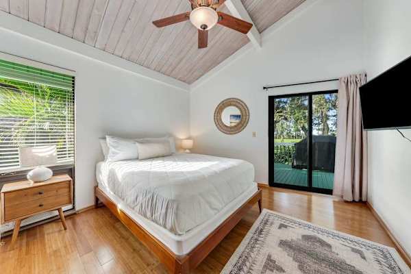 French doors invite morning air across welcoming timber floors indoors