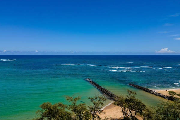 Gaze out over the crashing waves on to the white sandy beaches.