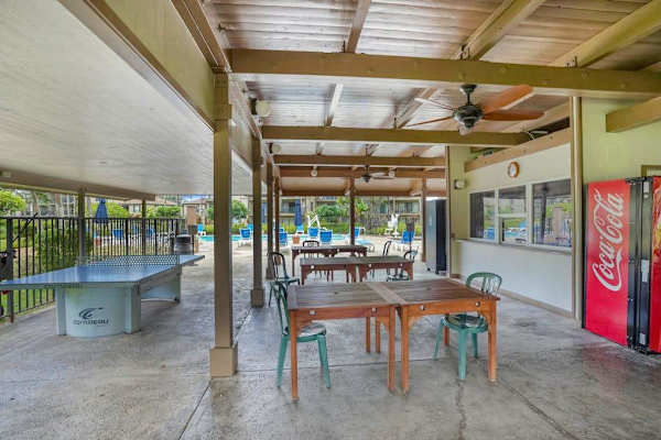 Pono Kai Resort, includes 12-acre grounds, an outdoor pool, a hot tub, a shuffleboard area, a barbecue facility with gas grills, a sauna, golf putting greens, Ping-Pong tables, a croquet lawn, a fitness center, tennis courts, and laundry facilities.