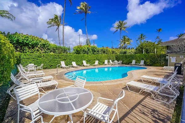 Poolside Relaxation Under Blue Skies