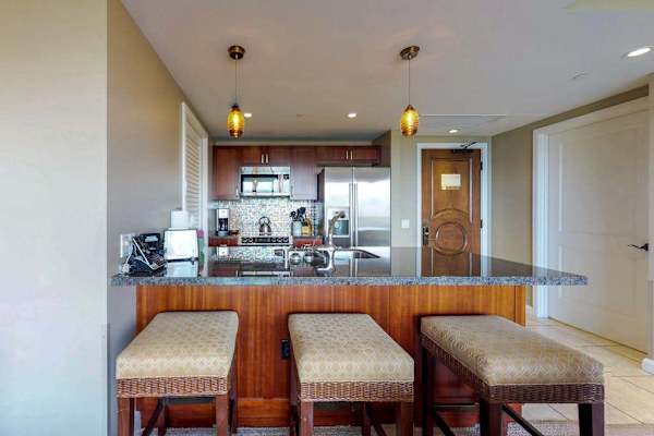 Kitchen island with comfortable bar stools, perfect for sharing casual meals or enjoying a few drinks together.