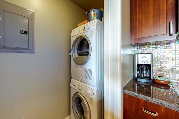 Stacked washer/dryer in unit for convenience