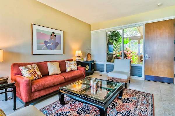Living room with comfortable seating with floor to ceiling windows for you to take in the amazing views of your tropical paradise.