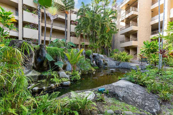 Lush Tropical Courtyard With Waterfall Gardens