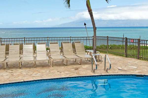 Hololani Resort community pool - amazing pool, swaying palm trees and steps to the ocean.