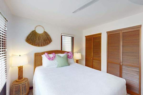 Comfortable Queen bed in a bright tropical retreat