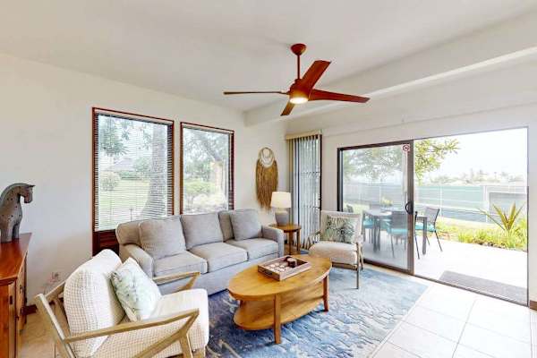Bright living room with comfortable seating and garden view